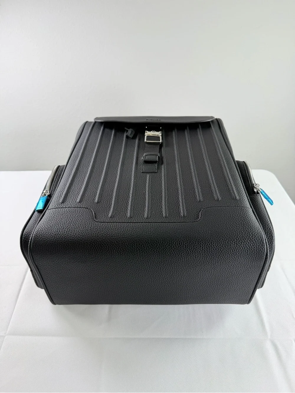 RIMOWA Black Textured Leather Backpack with Blue Zip Accents